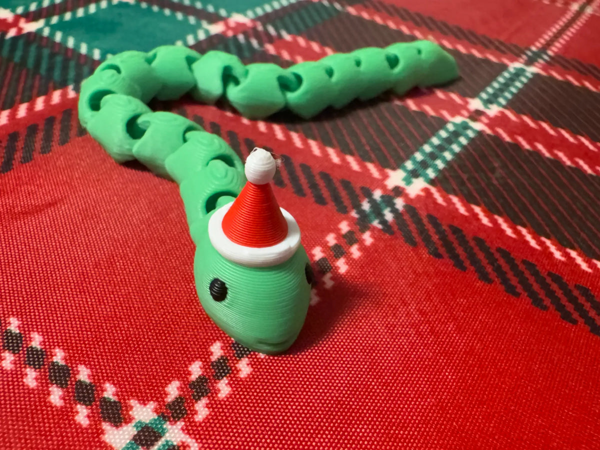 Mini Serpent Articulé de Noël avec Bonnet de Père Noël - Jeux Print