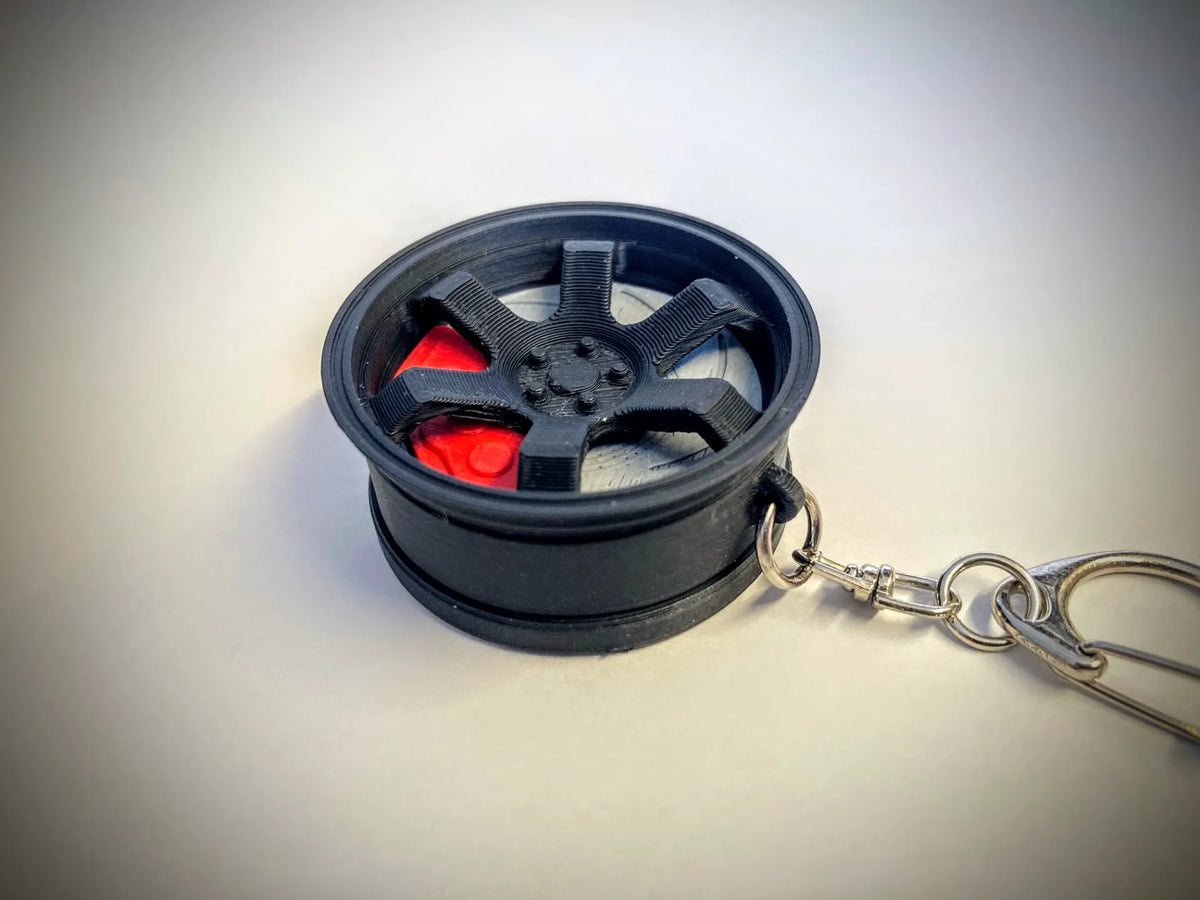 Porte-clés AirTag en forme de roue - Auto Print
