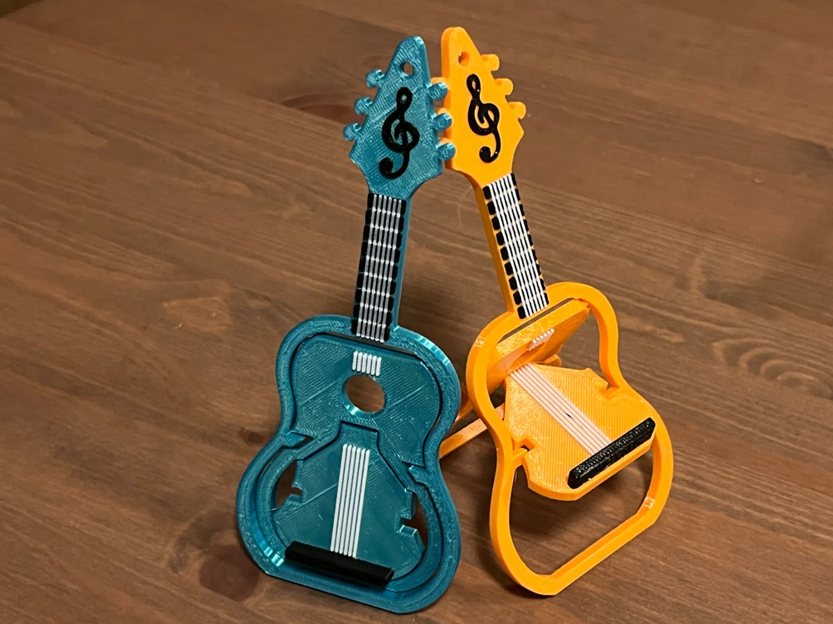 Chaise portable en forme de guitare + support téléphone - Music Print