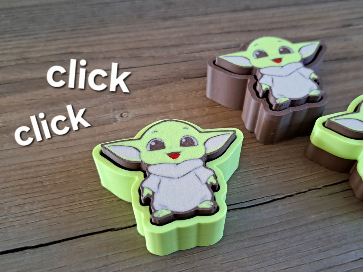Superbe jouet anti-stress Bébé Yoda Star Wars avec clic - Geek Print
