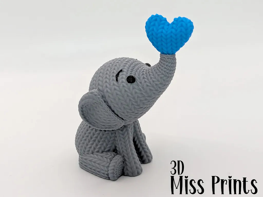 Éléphant tricoté soufflant un cœur - Fêtes Print